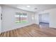 Bright living room with wood-look floors and a view to the backyard at 6420 Rosemount Ave, Las Vegas, NV 89156