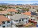 Residential neighborhood showcasing a home with a well-maintained backyard and landscaping with city views at 6639 Tranquil Seas Ct, Las Vegas, NV 89139