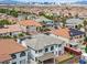 Aerial view of a residential neighborhood showcasing a home with a well-maintained backyard and landscaping at 6639 Tranquil Seas Ct, Las Vegas, NV 89139