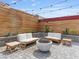 Cozy backyard seating area with a modern fire pit and stylish landscaping at 6639 Tranquil Seas Ct, Las Vegas, NV 89139