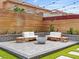 Backyard patio area featuring string lights, fire pit, and outdoor seating at 6639 Tranquil Seas Ct, Las Vegas, NV 89139