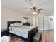 Calming bedroom has hardwood floors, ceiling fan, neutral paint and closet at 6639 Tranquil Seas Ct, Las Vegas, NV 89139