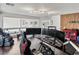 Spacious bonus room has hardwood floors, neutral paint, and multiple workspaces at 6639 Tranquil Seas Ct, Las Vegas, NV 89139