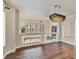 Well lit dining room featuring hardwood floors and contemporary lighting fixture at 6639 Tranquil Seas Ct, Las Vegas, NV 89139