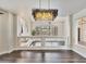 Bright dining room features hardwood floors and a modern chandelier lighting fixture at 6639 Tranquil Seas Ct, Las Vegas, NV 89139