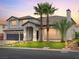 Charming two-story home featuring a three-car garage, lush lawn, and desert landscaping at 6639 Tranquil Seas Ct, Las Vegas, NV 89139