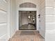 Inviting foyer showcasing an open floor plan with tile flooring and clear sightlines to other living spaces at 6639 Tranquil Seas Ct, Las Vegas, NV 89139