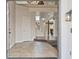 Open foyer features tile flooring, white walls, and natural light, leading to the staircase and main living area at 6639 Tranquil Seas Ct, Las Vegas, NV 89139