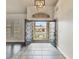 Open double front door reveals a view of the exterior, highlighting the home's curb appeal and inviting entryway at 6639 Tranquil Seas Ct, Las Vegas, NV 89139
