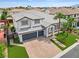 Beautiful two-story home featuring a well-manicured lawn, brick driveway, and an attached two-car garage at 6639 Tranquil Seas Ct, Las Vegas, NV 89139