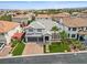 Charming home with manicured lawn, palm trees, and a brick driveway, nestled in a quiet neighborhood at 6639 Tranquil Seas Ct, Las Vegas, NV 89139