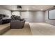 Carpeted home theater with multiple reclining seats, projector, and large screen at 6639 Tranquil Seas Ct, Las Vegas, NV 89139