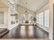 Spacious open living room with dark hardwood floors, modern fireplace, and soaring ceilings at 6639 Tranquil Seas Ct, Las Vegas, NV 89139
