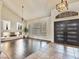 Inviting living room with a fireplace, high ceilings, modern furnishings and hardwood floors at 6639 Tranquil Seas Ct, Las Vegas, NV 89139