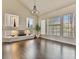 Open living room showcasing hardwood floors, a modern fireplace, and plenty of natural light at 6639 Tranquil Seas Ct, Las Vegas, NV 89139