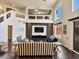 Open living room featuring soaring ceilings, hardwood floors, and bright, natural light at 6639 Tranquil Seas Ct, Las Vegas, NV 89139