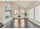 Spacious open living room with dark hardwood floors, modern fireplace, and soaring ceilings at 6639 Tranquil Seas Ct, Las Vegas, NV 89139
