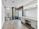 Luxurious main bathroom featuring dual vanity sinks, a modern glass shower, and stylish decor at 6639 Tranquil Seas Ct, Las Vegas, NV 89139