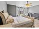 Bright main bedroom suite with neutral walls, ceiling fan, and backyard views at 6639 Tranquil Seas Ct, Las Vegas, NV 89139
