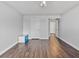 Spacious room featuring hardwood floors and ample natural light, offering a versatile living space at 6639 Tranquil Seas Ct, Las Vegas, NV 89139