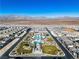 An aerial view showcases a community recreation area with a pool and neatly planned green spaces at 6952 Crescent Gold St, North Las Vegas, NV 89086