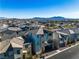 Aerial view of two story home in a suburban neighborhood near green spaces and a community pool at 6952 Crescent Gold St, North Las Vegas, NV 89086