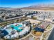 This aerial photo highlights the community pool, playground, and well-maintained landscaping at 6952 Crescent Gold St, North Las Vegas, NV 89086