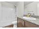 Clean bathroom with granite countertop, shower-tub combo, and modern fixtures at 6952 Crescent Gold St, North Las Vegas, NV 89086