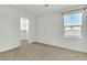 Bedroom with a walk-in closet and neutral carpet; bright and move-in ready at 6952 Crescent Gold St, North Las Vegas, NV 89086