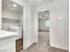 This is a view from the hallway looking into the laundry room and bedroom at 6952 Crescent Gold St, North Las Vegas, NV 89086