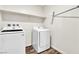 The laundry room is equipped with a washer, dryer and storage shelf at 6952 Crescent Gold St, North Las Vegas, NV 89086
