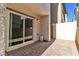 Private paver patio area with sliding glass door, offering a tranquil outdoor space at 6952 Crescent Gold St, North Las Vegas, NV 89086