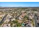 Panoramic aerial view of the home's neighborhood with mountain views, pool, and convenient street access at 7221 Harlow St, Las Vegas, NV 89131