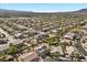Neighborhood aerial features sprawling homes with pools, landscaping, and serene desert mountain vistas at 7221 Harlow St, Las Vegas, NV 89131