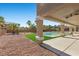 View of the backyard patio and pool area with low maintenance landscaping at 7221 Harlow St, Las Vegas, NV 89131