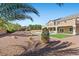 Expansive backyard featuring desert landscaping, a pool, and a covered patio at 7221 Harlow St, Las Vegas, NV 89131