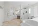 A bathroom featuring a soaking tub, glass enclosed shower, and dual vanity at 7221 Harlow St, Las Vegas, NV 89131