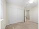 Cozy bedroom with neutral walls, plush carpet, ceiling fan, and ample closet space at 7221 Harlow St, Las Vegas, NV 89131
