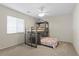Carpeted bedroom featuring a bunk bed, ceiling fan and window at 7221 Harlow St, Las Vegas, NV 89131