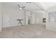 Large bonus room with a fireplace, neutral carpet, ceiling fan, and plenty of natural light at 7221 Harlow St, Las Vegas, NV 89131