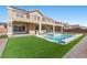 Back exterior view of a two-story home showcasing the pool, patio, and second-story balcony at 7221 Harlow St, Las Vegas, NV 89131