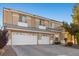 Home features an attached two-car garage and paved driveway, offering convenience and ample parking at 7221 Harlow St, Las Vegas, NV 89131