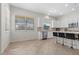 Bright kitchen features white cabinets, stainless appliances, and a large island at 7221 Harlow St, Las Vegas, NV 89131
