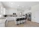 Modern kitchen with stainless appliances, sleek white cabinets, and a center island with barstool seating at 7221 Harlow St, Las Vegas, NV 89131