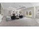 Bright and airy living room with a cozy fireplace, recessed ceilings, and french doors to the backyard at 7221 Harlow St, Las Vegas, NV 89131