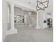 Open-concept living space featuring architectural columns and a view of the kitchen and dining areas at 7221 Harlow St, Las Vegas, NV 89131