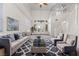 Elegant living room with plush seating, stylish decor, and bright, natural light through clerestory windows at 7221 Harlow St, Las Vegas, NV 89131