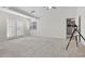 Bright main bedroom featuring carpet floors, fan, high ceiling, access to balcony, and lots of natural light at 7221 Harlow St, Las Vegas, NV 89131