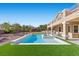 Beautiful backyard pool and spa with manicured turf, perfect for outdoor entertaining at 7221 Harlow St, Las Vegas, NV 89131