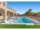 Stunning pool and spa featuring a baja shelf and pristine landscaping at 7221 Harlow St, Las Vegas, NV 89131